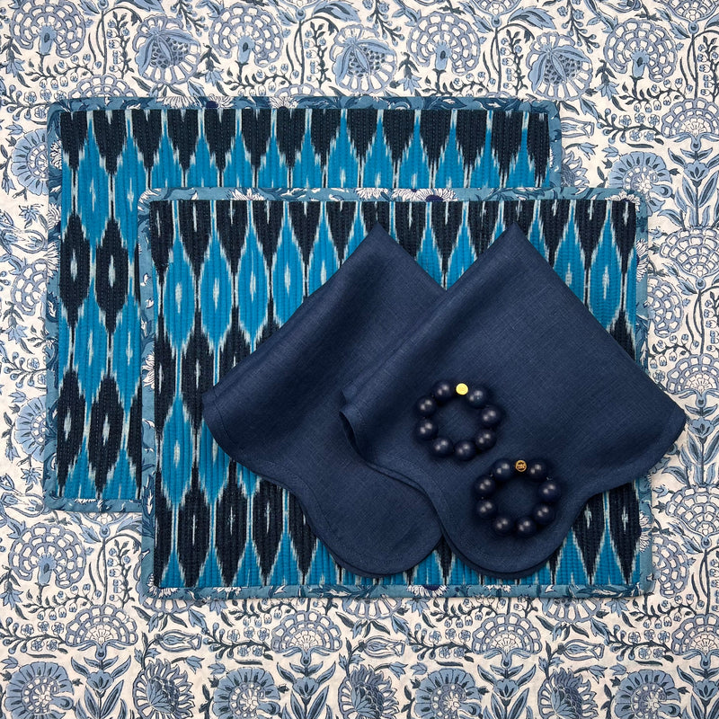 Gift Set: 2 Blue Ikat Placemats, 2 navy scalloped linen napkins, 2 wood orb napkinrings